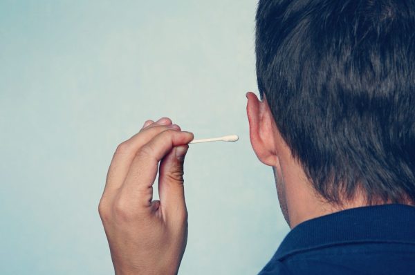 Is it alright to remove earwax with cotton swab