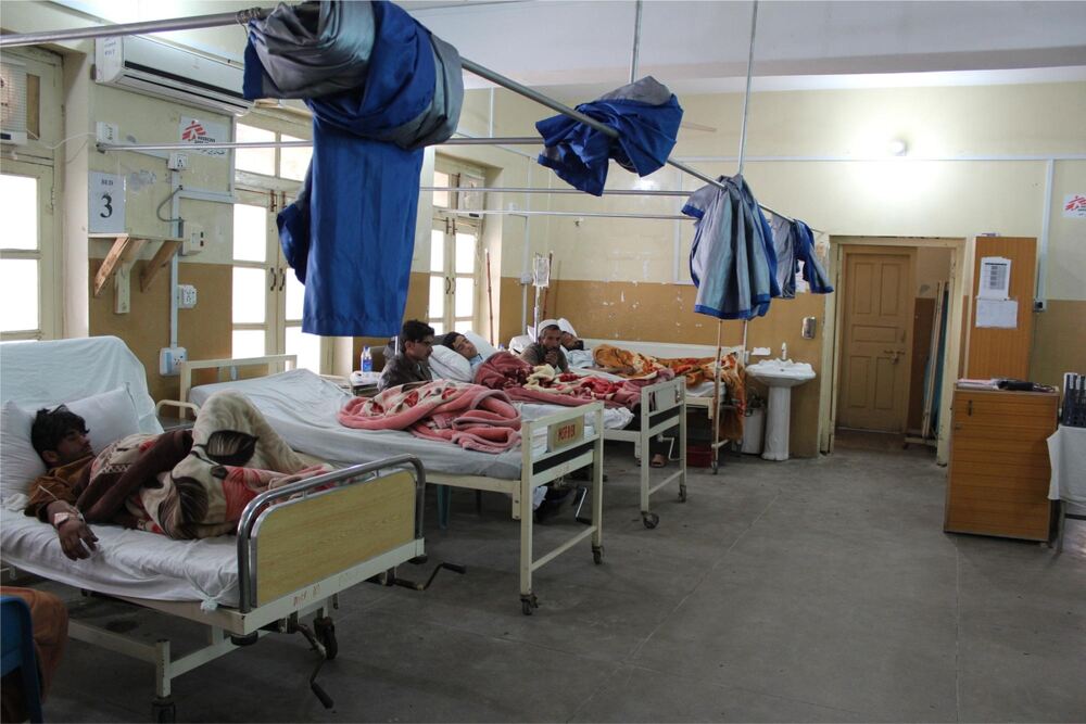 Patients waiting in a hospital ward for medical treatment