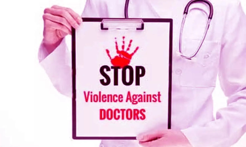 A doctor holding a placard demanding protection and safety for doctors and healthcare workers in hospitals