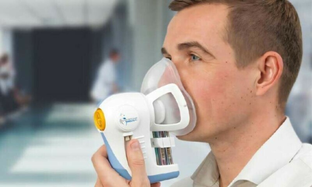 A person undergoing a breath test for early detection of pancreatic cancer