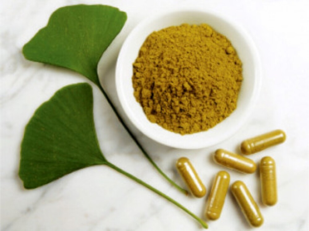 Herbal medicine display with fresh medicinal plant leaves