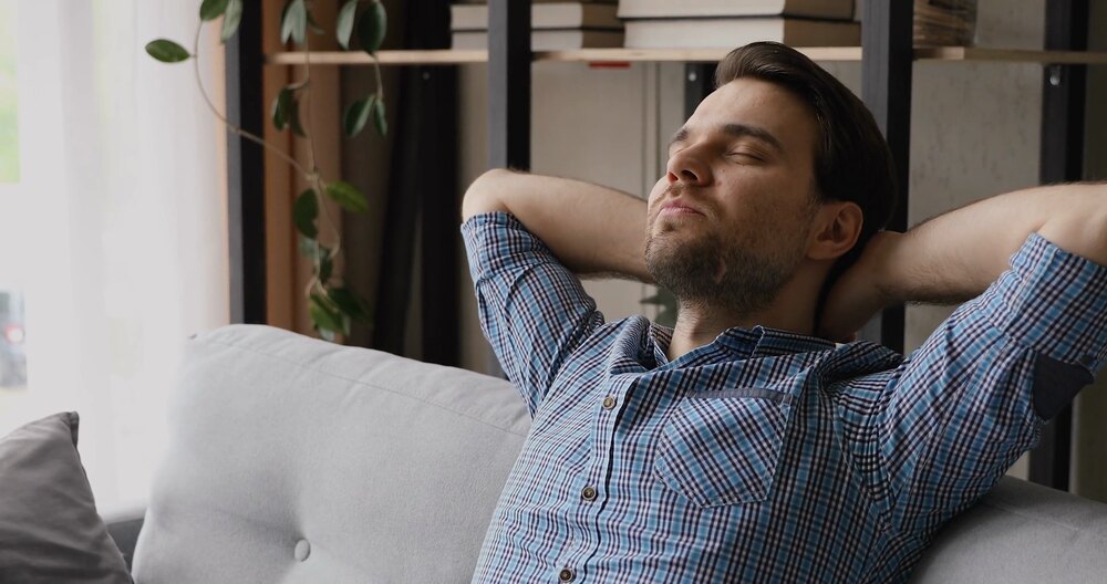 A person experiencing fatigue and low energy, feeling tired and drained