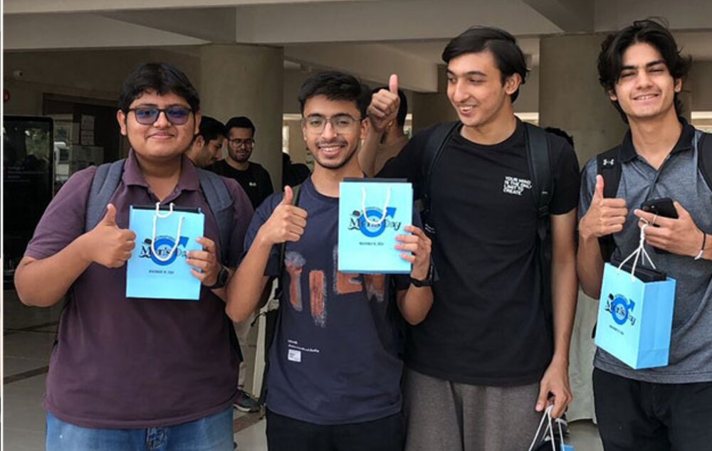 Male students carrying gifts as a token of care on International Men’s Day
