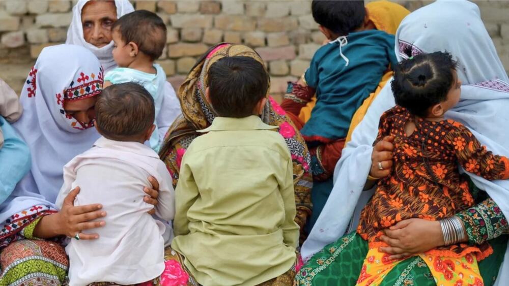 Children with their mothers in rural Sindh