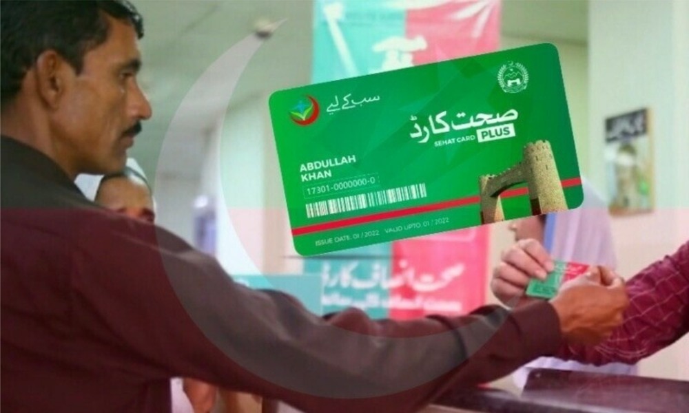 A person holding a Khyber Pakhtunkhwa Sehat Card Plus, symbolizing free medical treatment and healthcare access in Pakistan