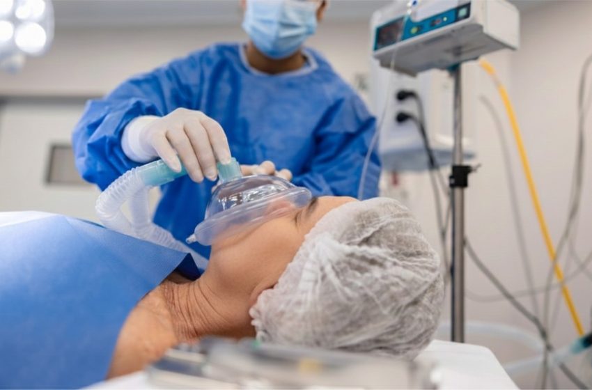 Patient receiving controlled nitrous oxide (laughing gas) therapy for severe depression in a clinical setting