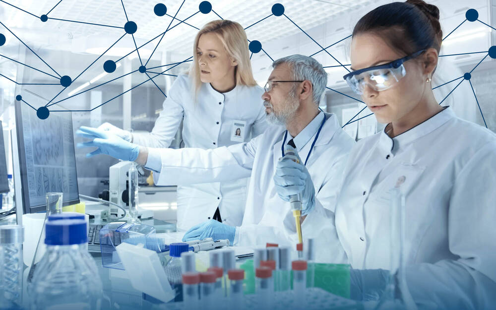 Laboratory with scientists working on AI-driven drug