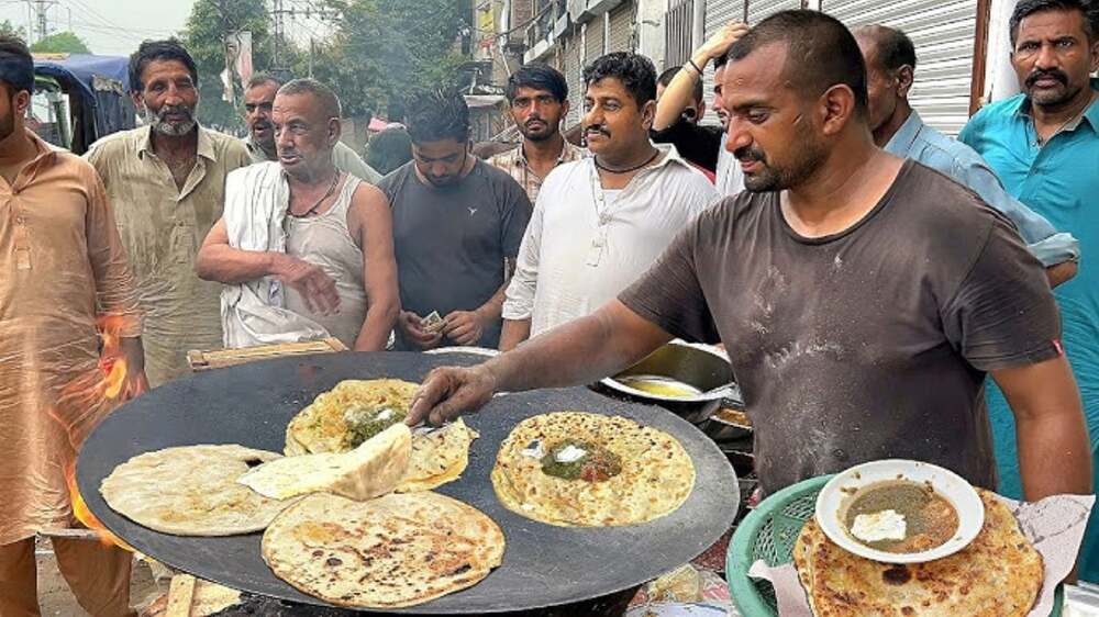 Street food vendors preparing food on the roadside