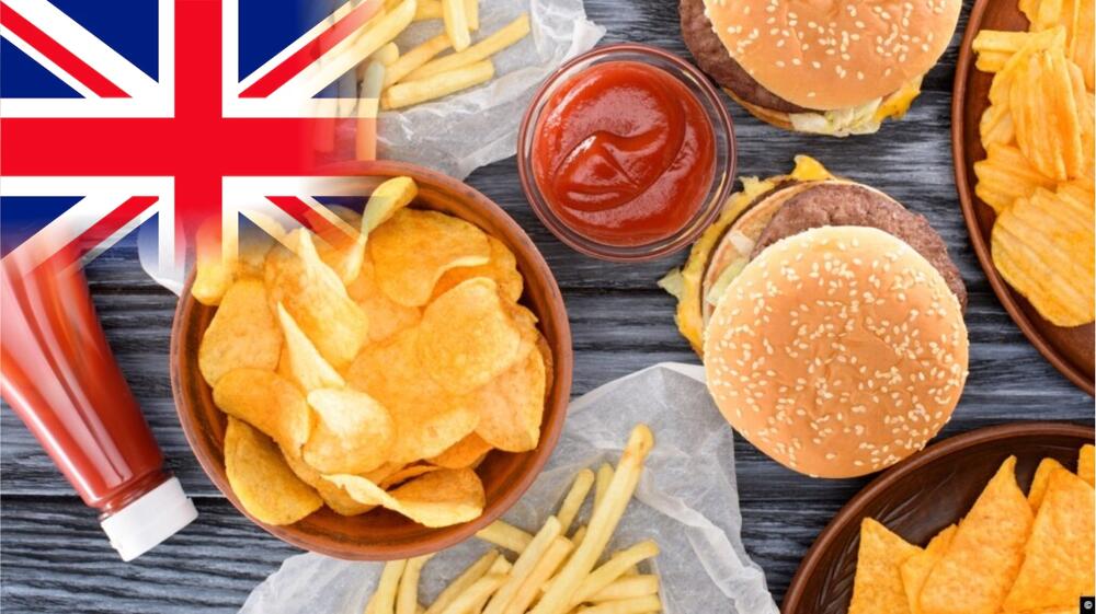 Junk food items with Britain flag in background symbolizing UK ban on unhealthy food advertising